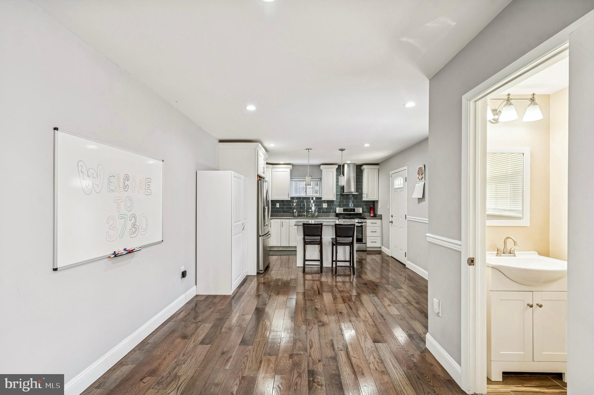 3730 Spring Garden Street Philadelphia, PA 19104 - Photo 9 of 24 a view of kitchen with furniture and wooden floor