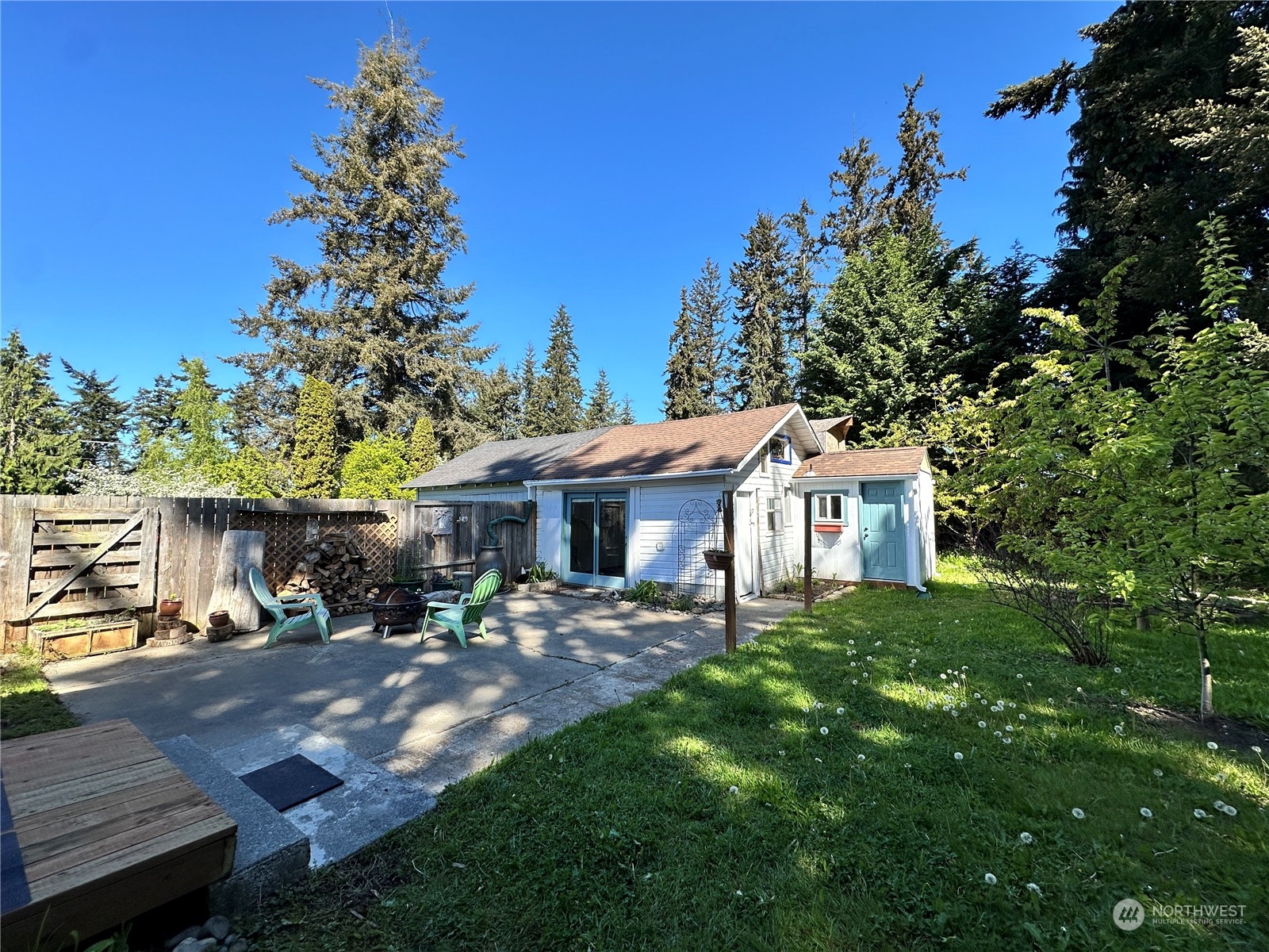 51 East Runnion Road Sequim, WA 98382 - Photo 19 of 40 a view of a house with backyard porch and sitting area