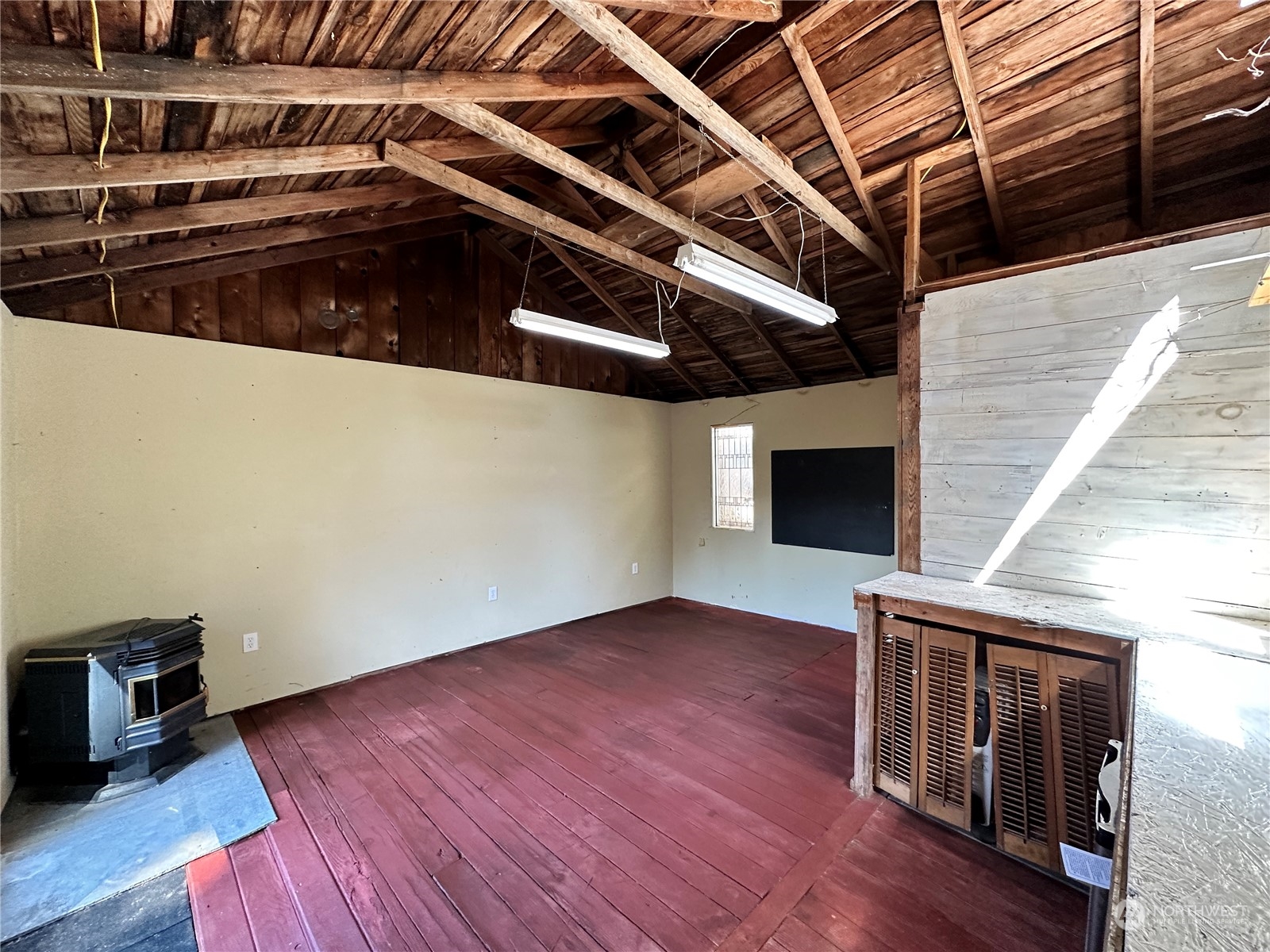 51 East Runnion Road Sequim, WA 98382 - Photo 20 of 40 a view of an empty room with wooden floor