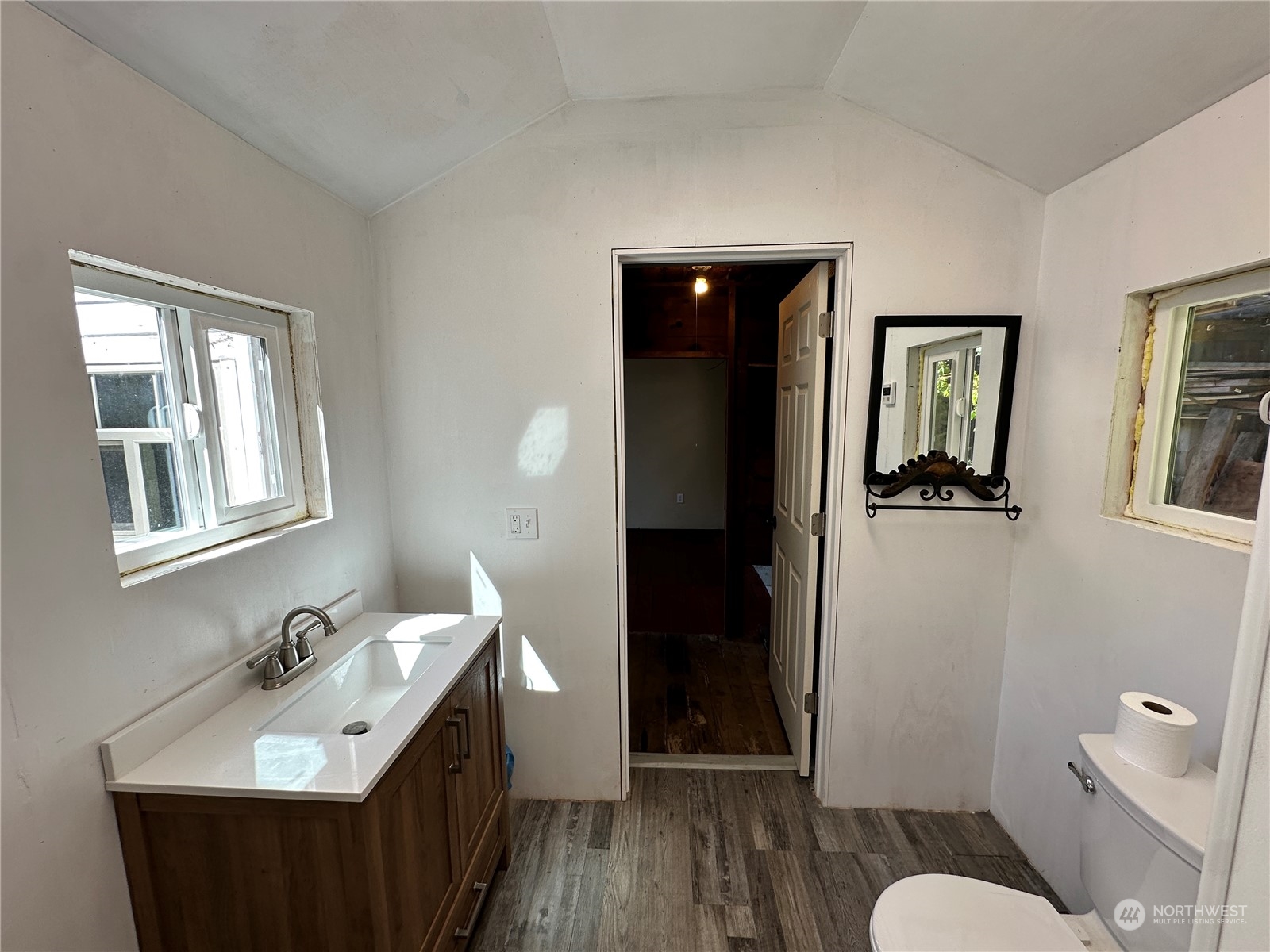 51 East Runnion Road Sequim, WA 98382 - Photo 24 of 40 a bathroom with a sink and a mirror