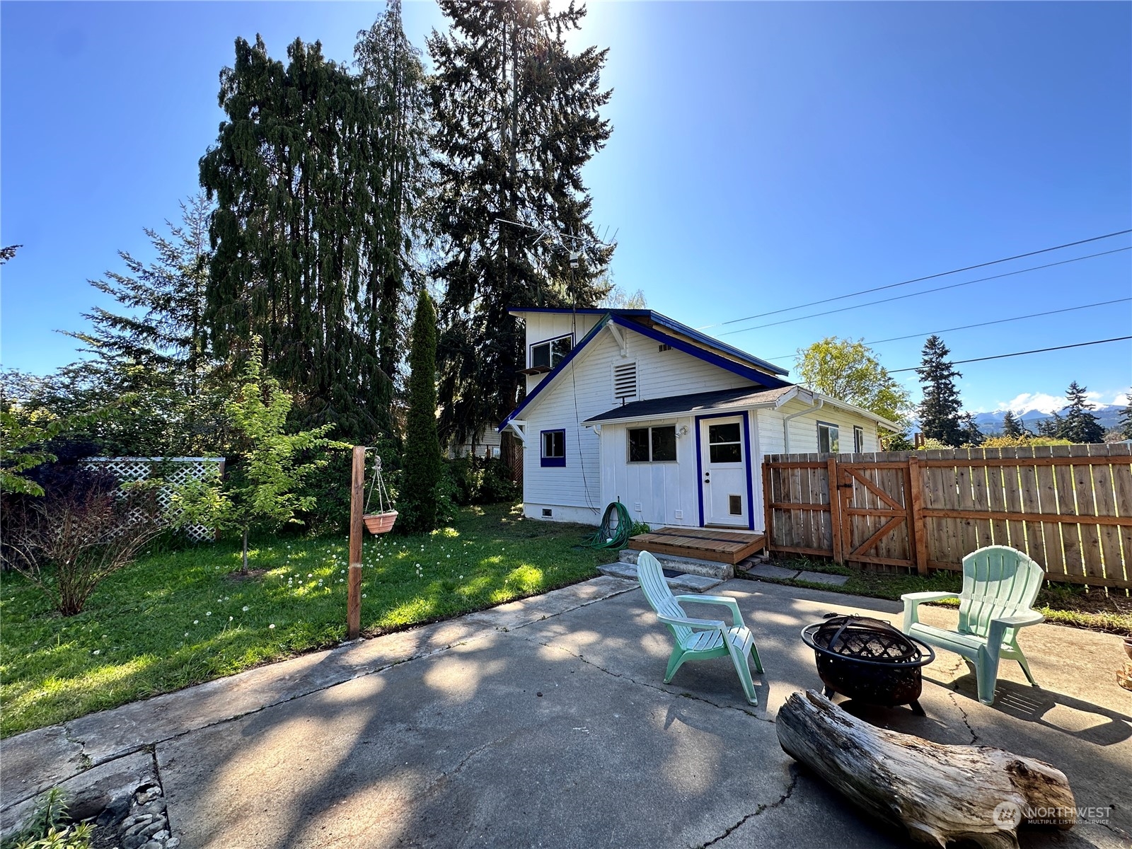 51 East Runnion Road Sequim, WA 98382 - Photo 27 of 40 a view of a patio with couches chairs and a yard