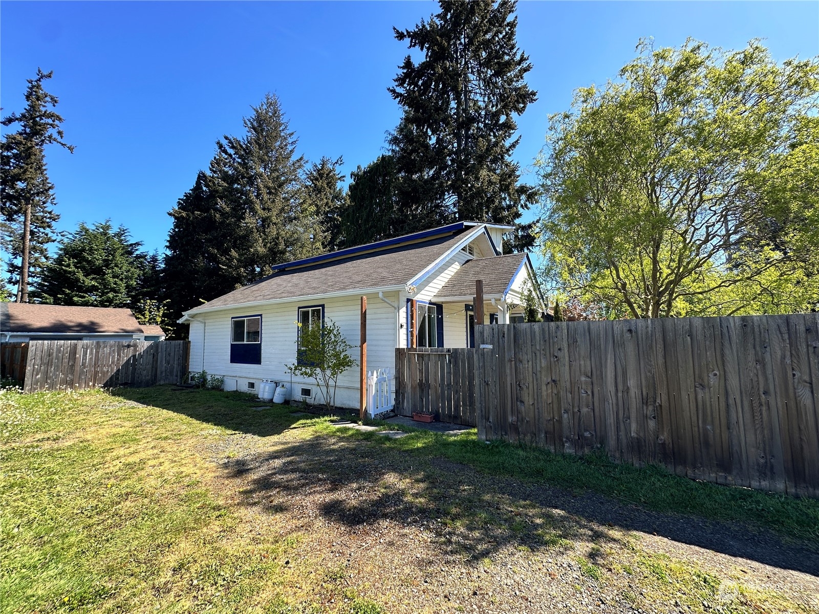 51 East Runnion Road Sequim, WA 98382 - Photo 34 of 40 a view of a house with yard and sitting area