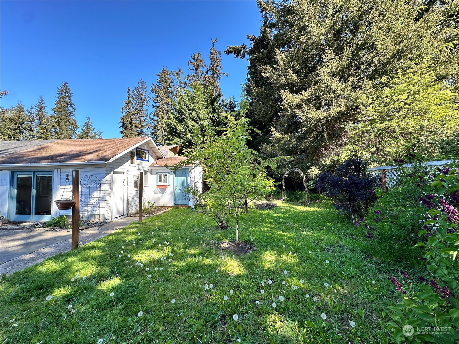 51 East Runnion Road Sequim, WA 98382 - Photo 36 of 40 a view of a house with a back yard