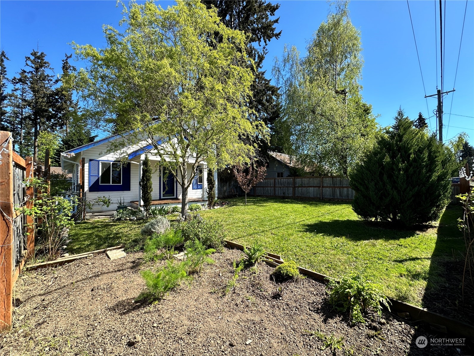 51 East Runnion Road Sequim, WA 98382 - Photo 37 of 40 a front view of a house with garden