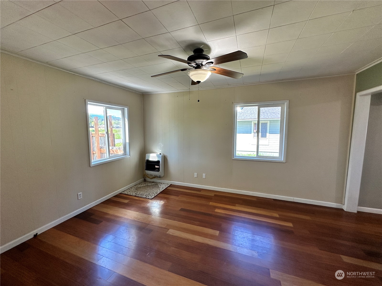 51 East Runnion Road Sequim, WA 98382 - Photo 6 of 40 a view of empty room with wooden floor and fan