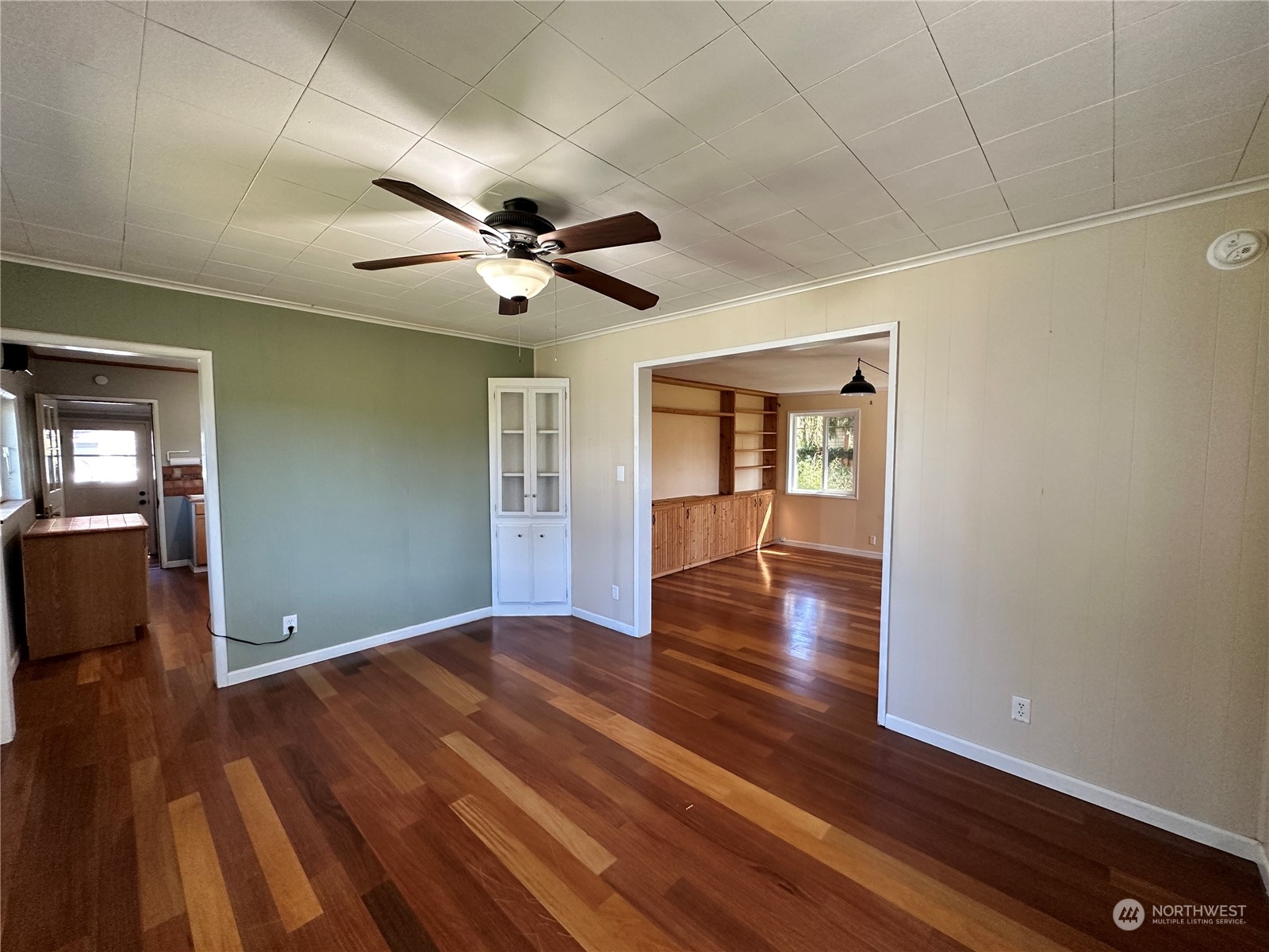 51 East Runnion Road Sequim, WA 98382 - Photo 7 of 40 a view of an empty room with wooden floor