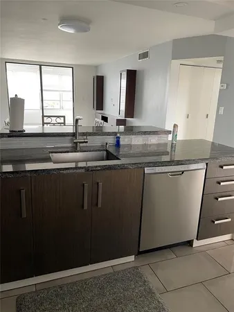 a kitchen with a sink and a window