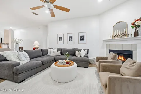 a living room with furniture and a fireplace