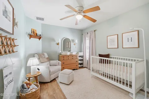 a bedroom with furniture and a window