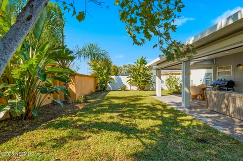 a view of an house with backyard space and garden