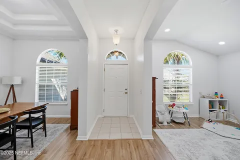 a bedroom with furniture and a window