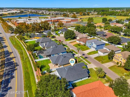 an aerial view of residential houses with outdoor space