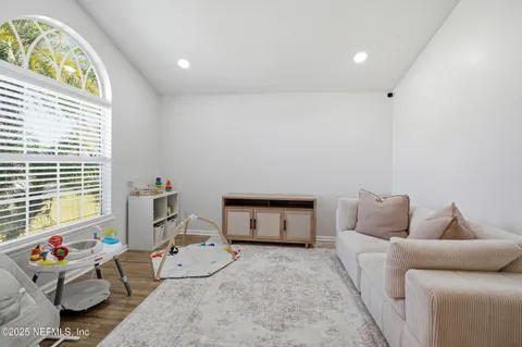 a bedroom with furniture and a window