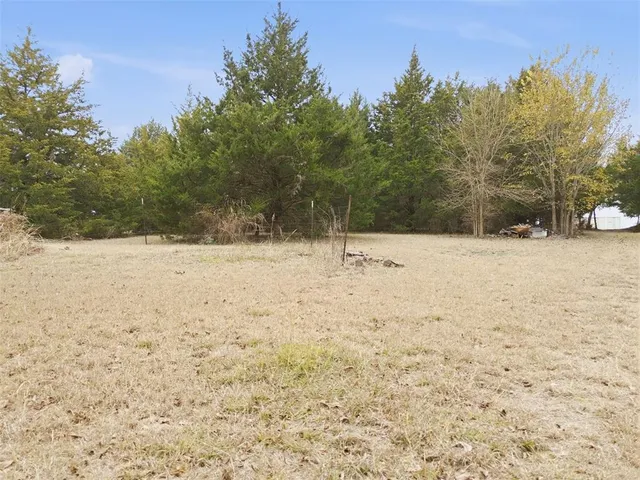 a view of a large body of water with a building in the background