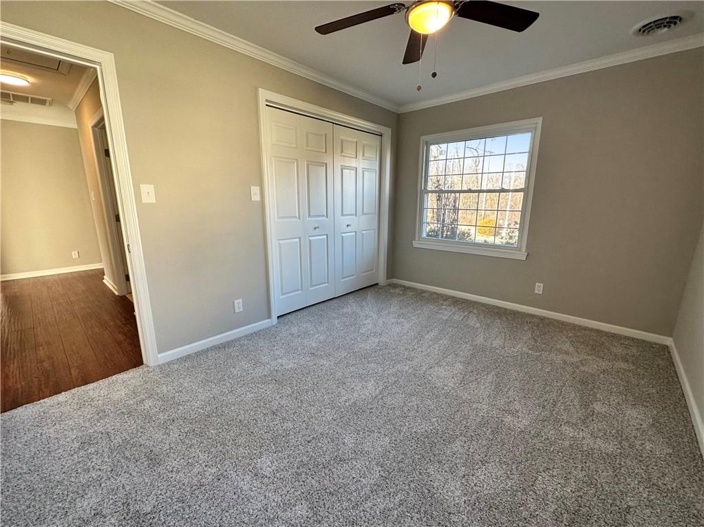 3095 Tuscarawas Road Beaver, PA 15009 - Photo 18 of 25 an empty room with chandelier fan and windows