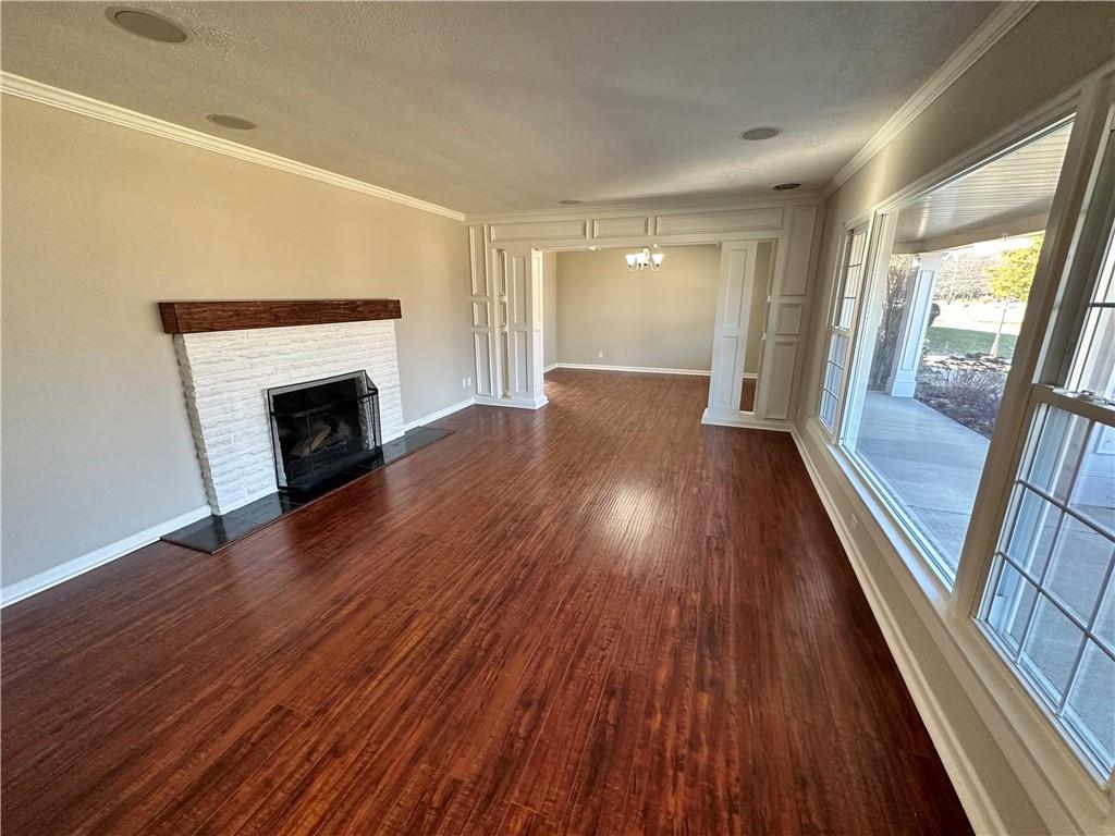 3095 Tuscarawas Road Beaver, PA 15009 - Photo 5 of 25 a view of empty room with wooden floor and fireplace