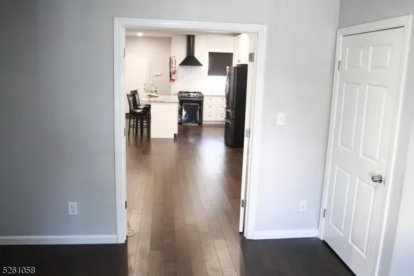 a view of kitchen with furniture and wooden floor