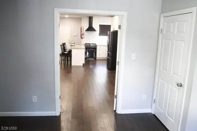 a view of kitchen with furniture and wooden floor