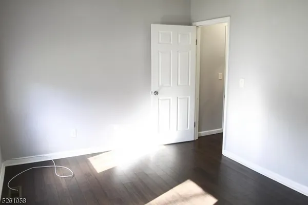 a view of a livingroom with wooden floor