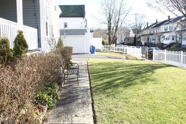 a swimming pool with outdoor seating and yard