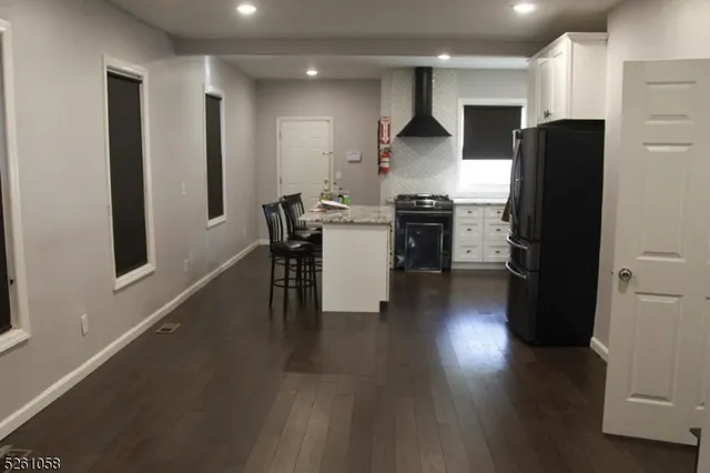 a kitchen with stainless steel appliances a refrigerator stove microwave and cabinets