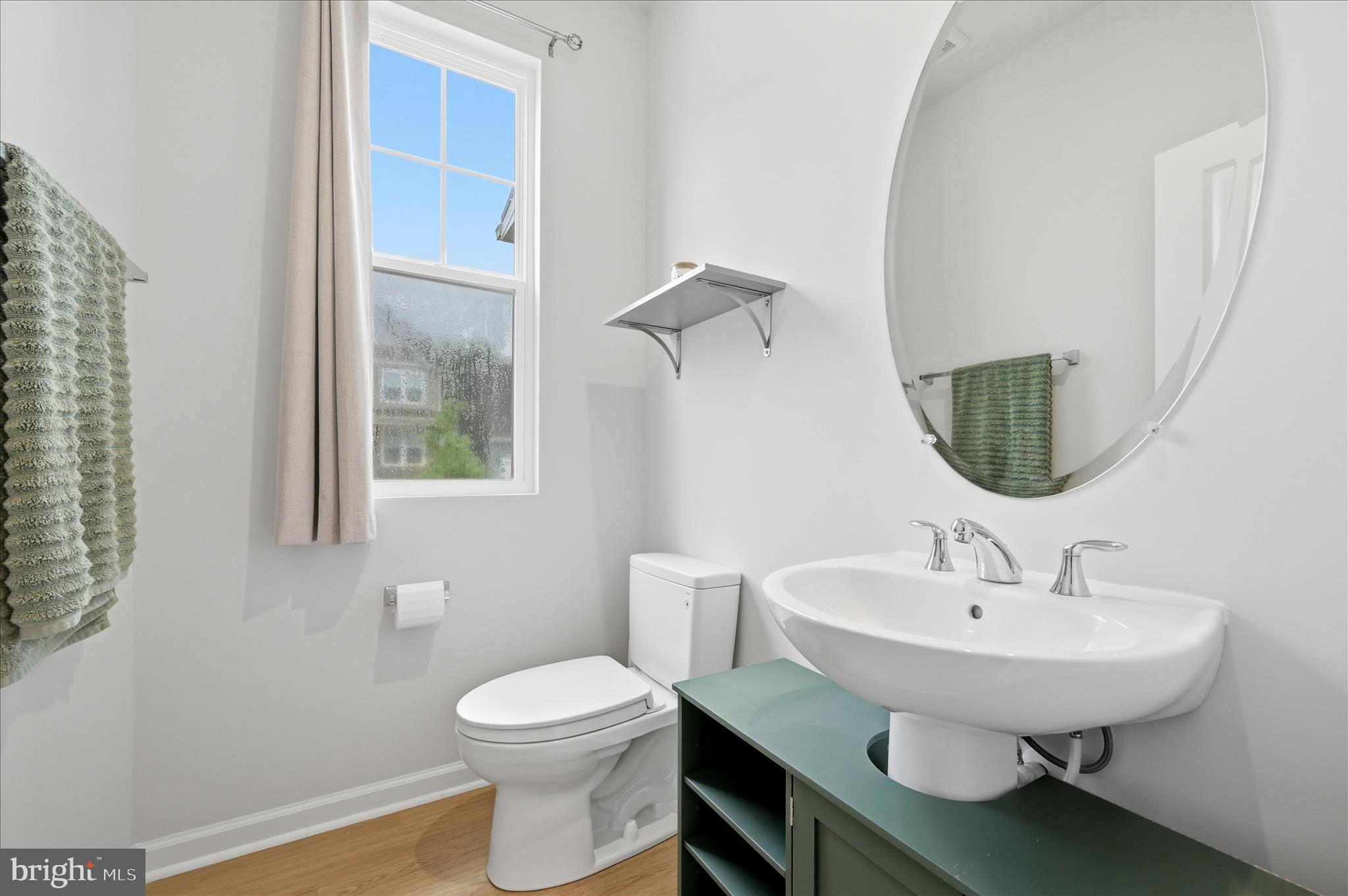 152 National Street Ranson, WV 25438 - Photo 20 of 53 a bathroom with a sink a toilet and mirror