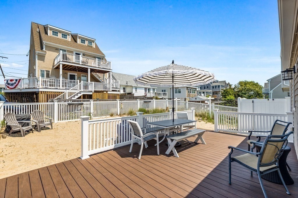 95 River Street Scituate, MA 02066 - Photo 14 of 23 a view of a roof deck with table and chairs