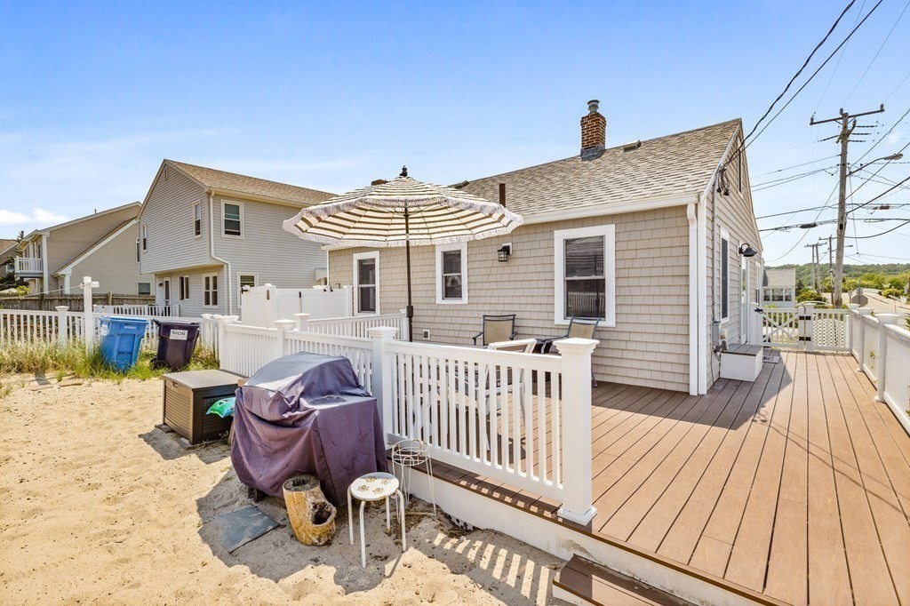 95 River Street Scituate, MA 02066 - Photo 17 of 23 a view of a house with wooden deck and furniture
