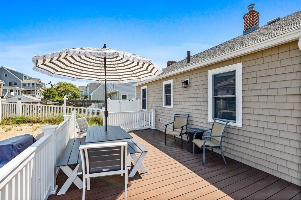 95 River Street Scituate, MA 02066 - Photo 20 of 23 a view of a roof deck with table and chairs a barbeque with wooden floor and fence