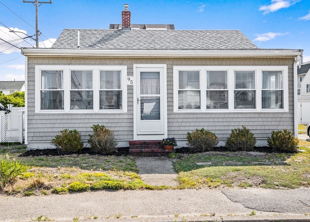 95 River Street Scituate, MA 02066 - Photo 4 of 23 a front view of a house with a yard