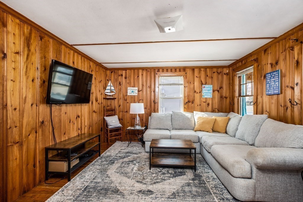 95 River Street Scituate, MA 02066 - Photo 6 of 23 a living room with furniture flat screen tv and a window