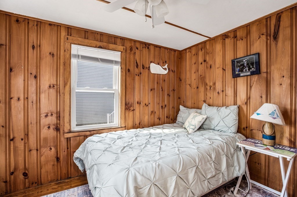 95 River Street Scituate, MA 02066 - Photo 10 of 23 a bedroom with a bed and a table