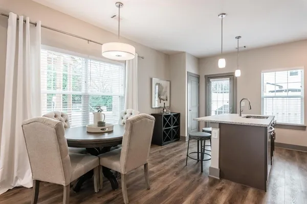 a dining room with furniture window wooden floor