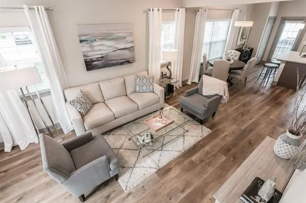 a living room with furniture or couch and a large window