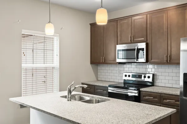 a kitchen with a stove and a sink