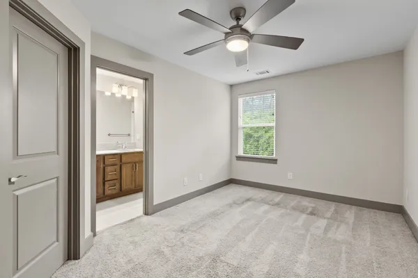 an empty room with ceiling fan and a ceiling fan
