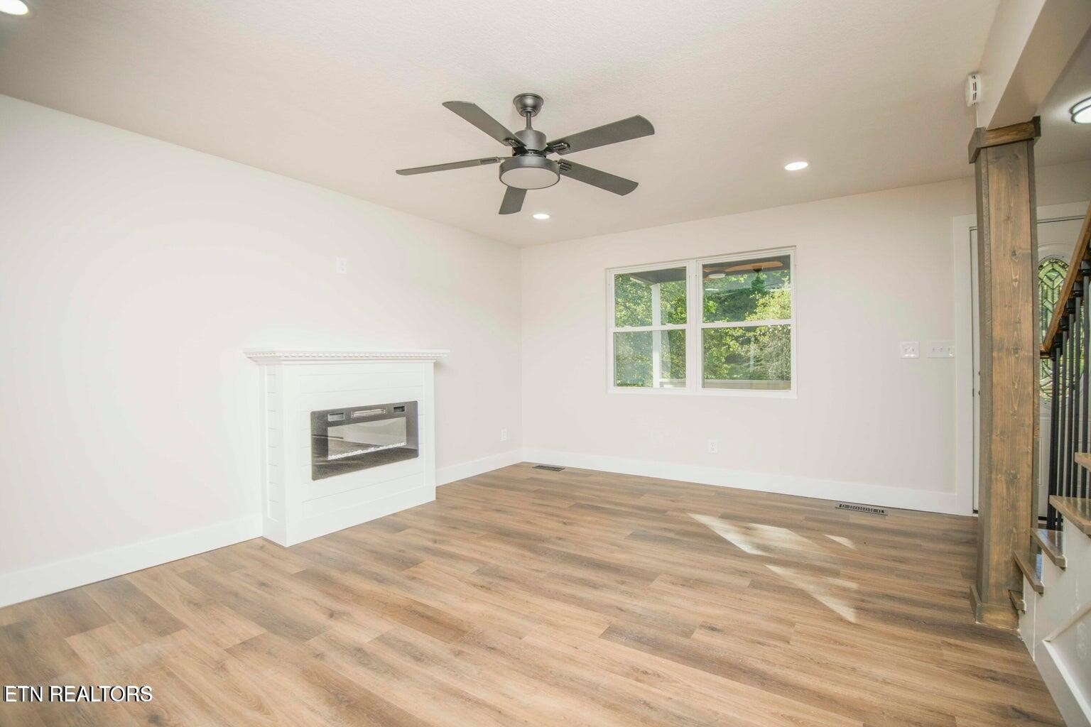 589 Possum Valley Road Maynardville, TN 37807 - Photo 11 of 49 a view of a bedroom with wooden floor and a window