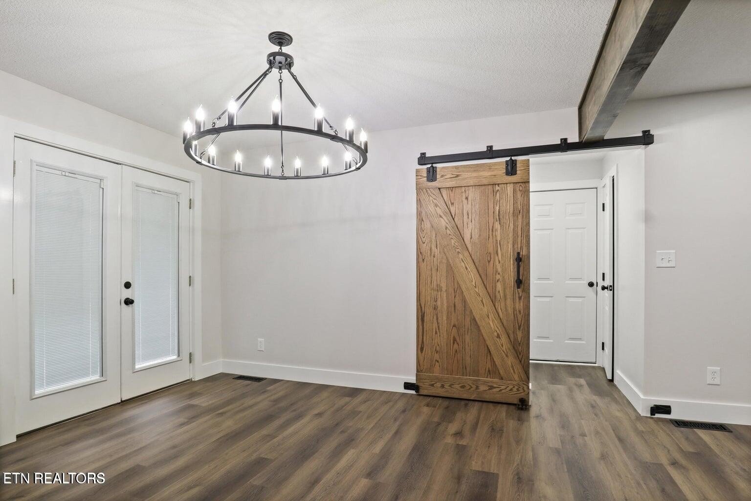 589 Possum Valley Road Maynardville, TN 37807 - Photo 13 of 49 a view of a room with wooden floor and carpet
