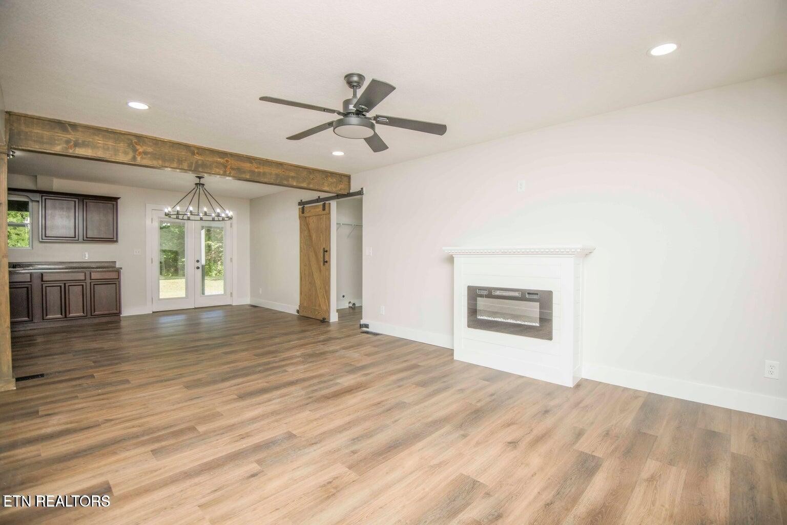 589 Possum Valley Road Maynardville, TN 37807 - Photo 14 of 49 a view of empty room with wooden floor and window