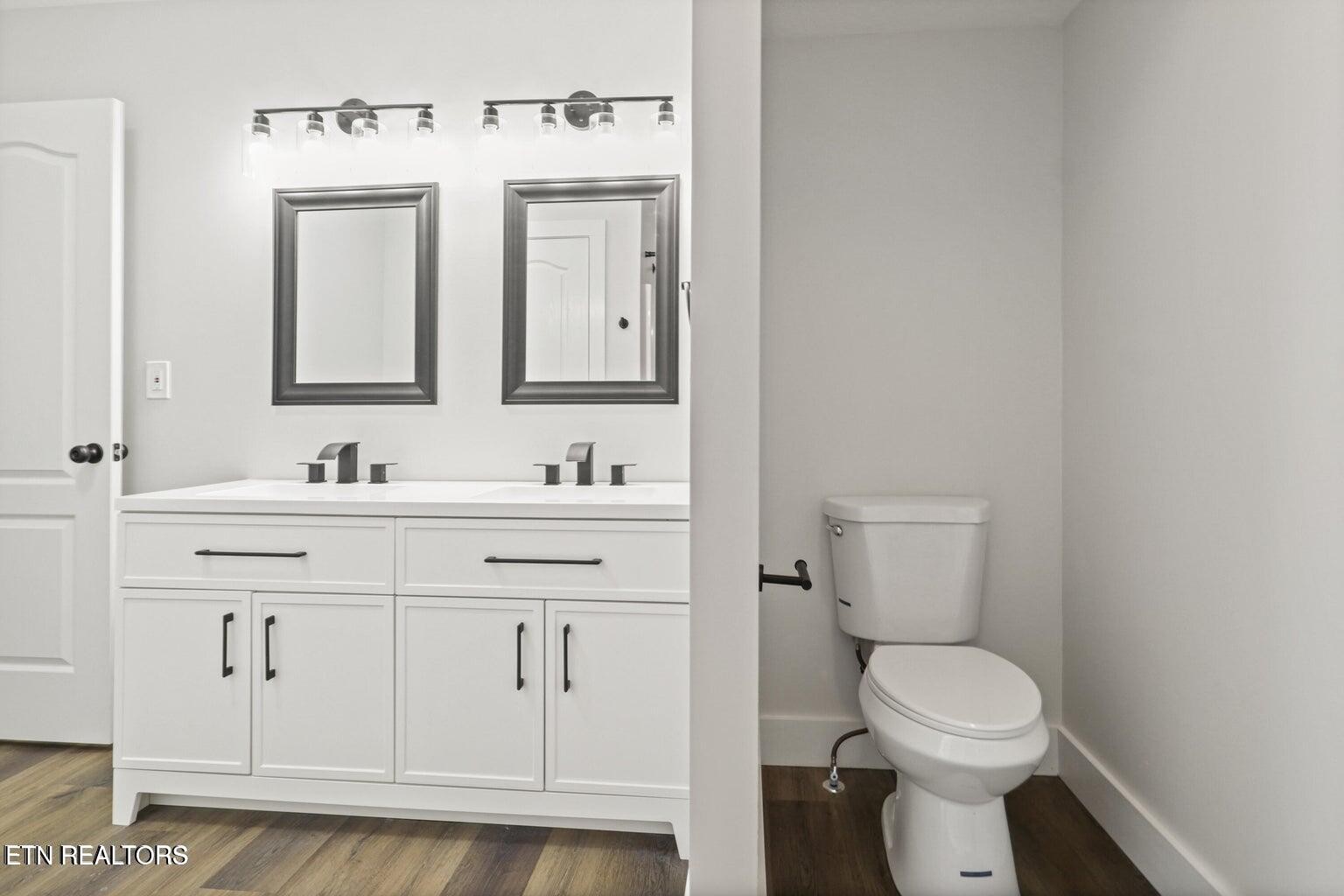 589 Possum Valley Road Maynardville, TN 37807 - Photo 26 of 49 a bathroom with a sink a toilet and a mirror