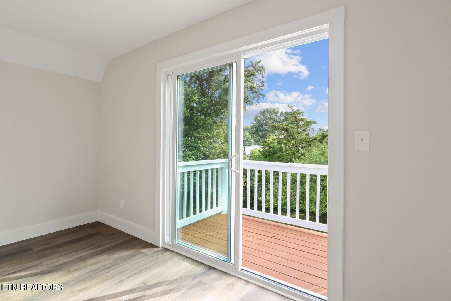 589 Possum Valley Road Maynardville, TN 37807 - Photo 29 of 49 an empty room with wooden floor and windows