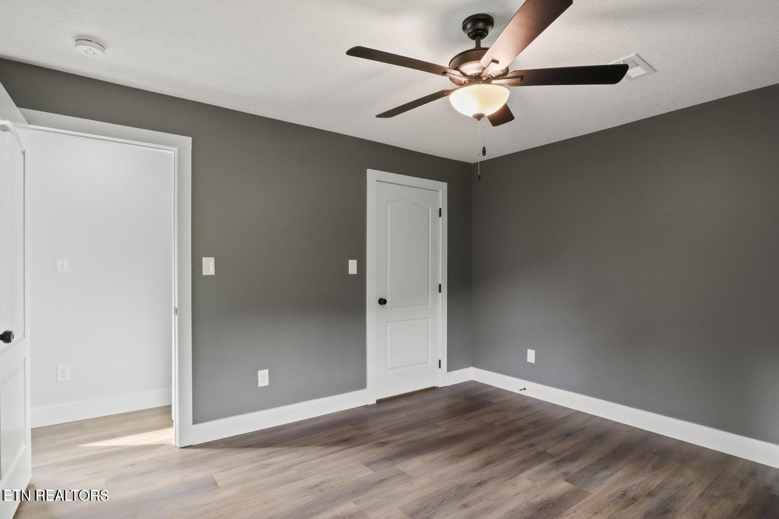 589 Possum Valley Road Maynardville, TN 37807 - Photo 31 of 49 an empty room with fan and a ceiling fan