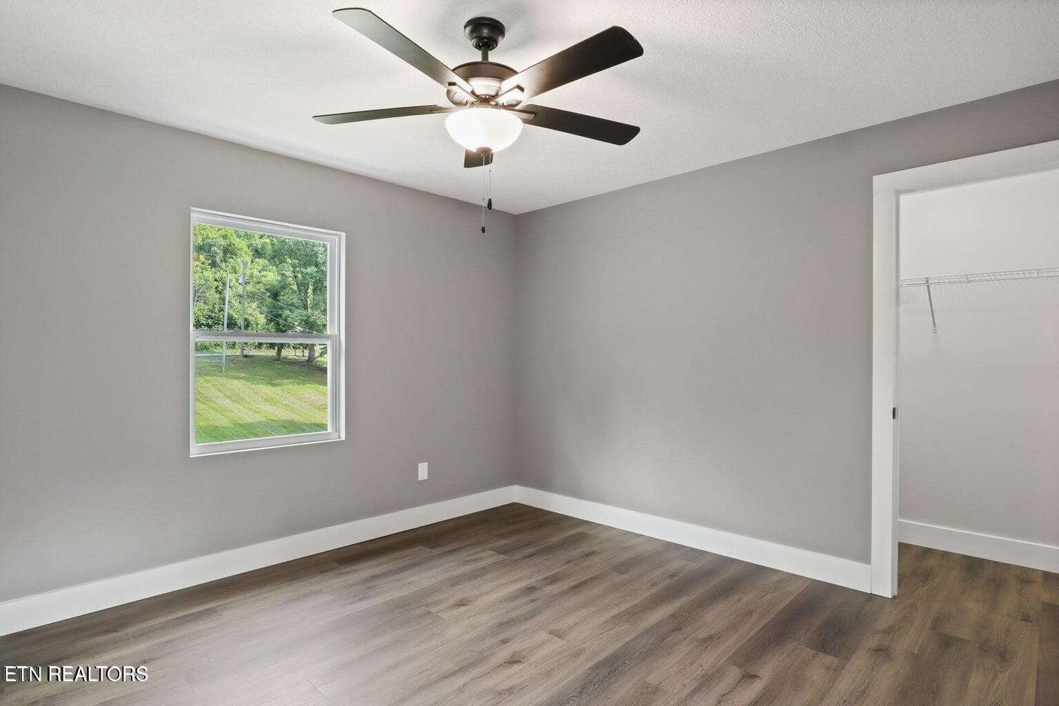 589 Possum Valley Road Maynardville, TN 37807 - Photo 34 of 49 wooden floor in an empty room with a window