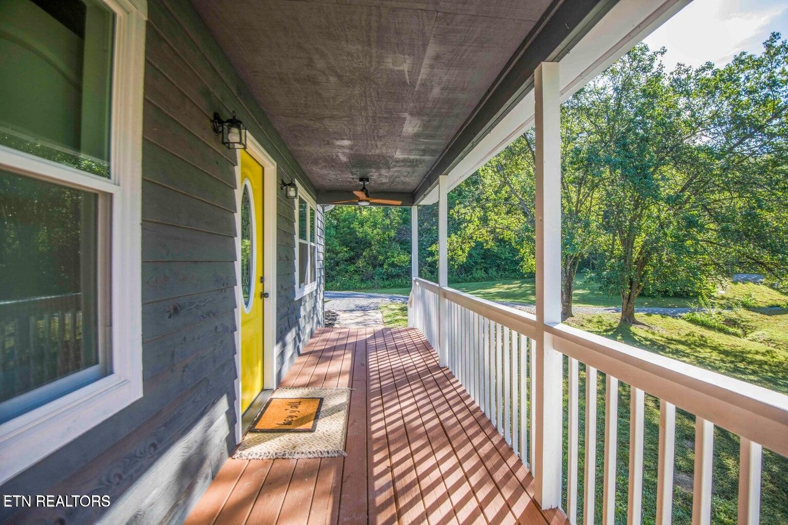 589 Possum Valley Road Maynardville, TN 37807 - Photo 5 of 49 a view of balcony with wooden floor and outdoor space