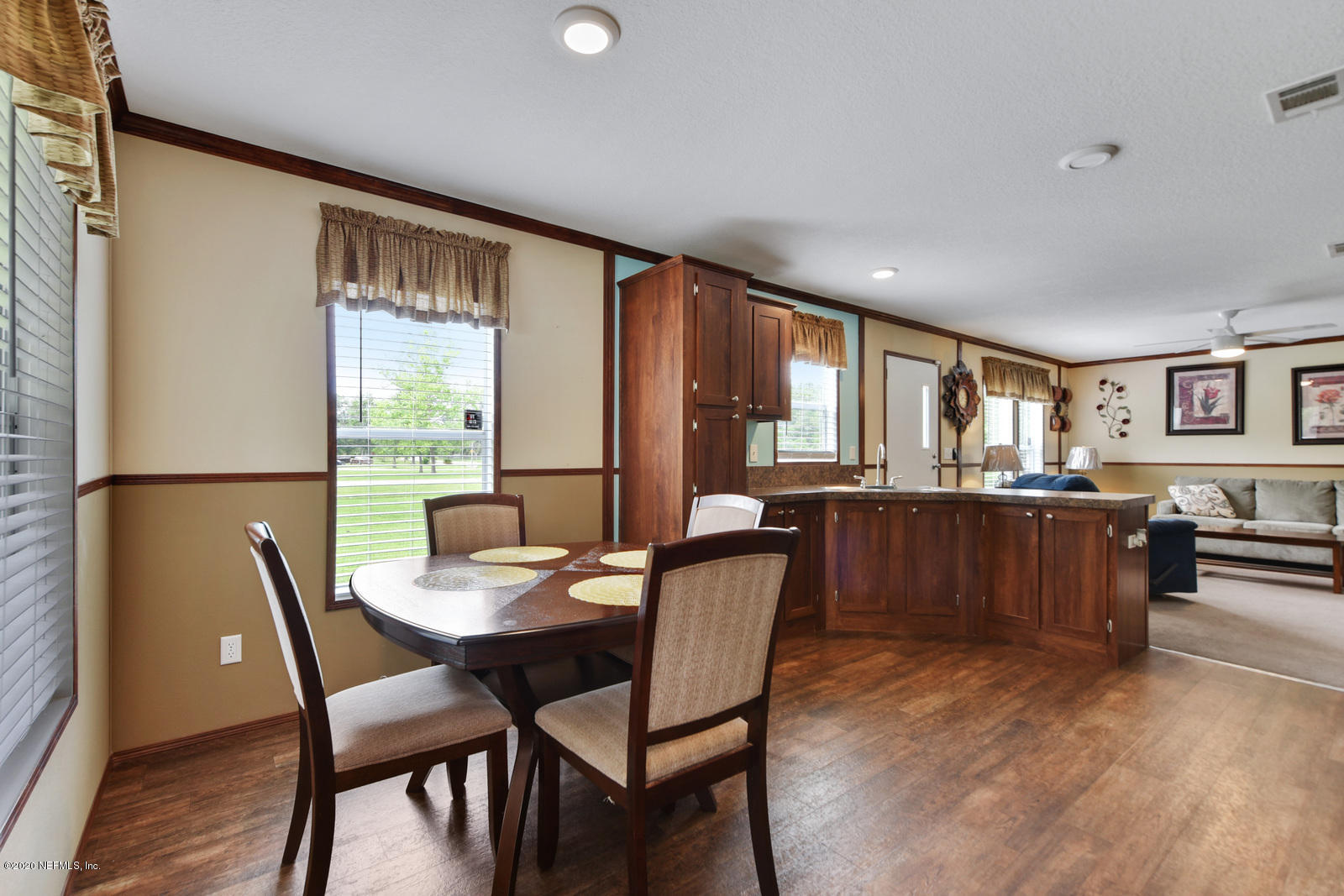 54464 Sherwood Road Callahan, FL 32011 - Photo 13 of 25 a dining room with furniture and large window