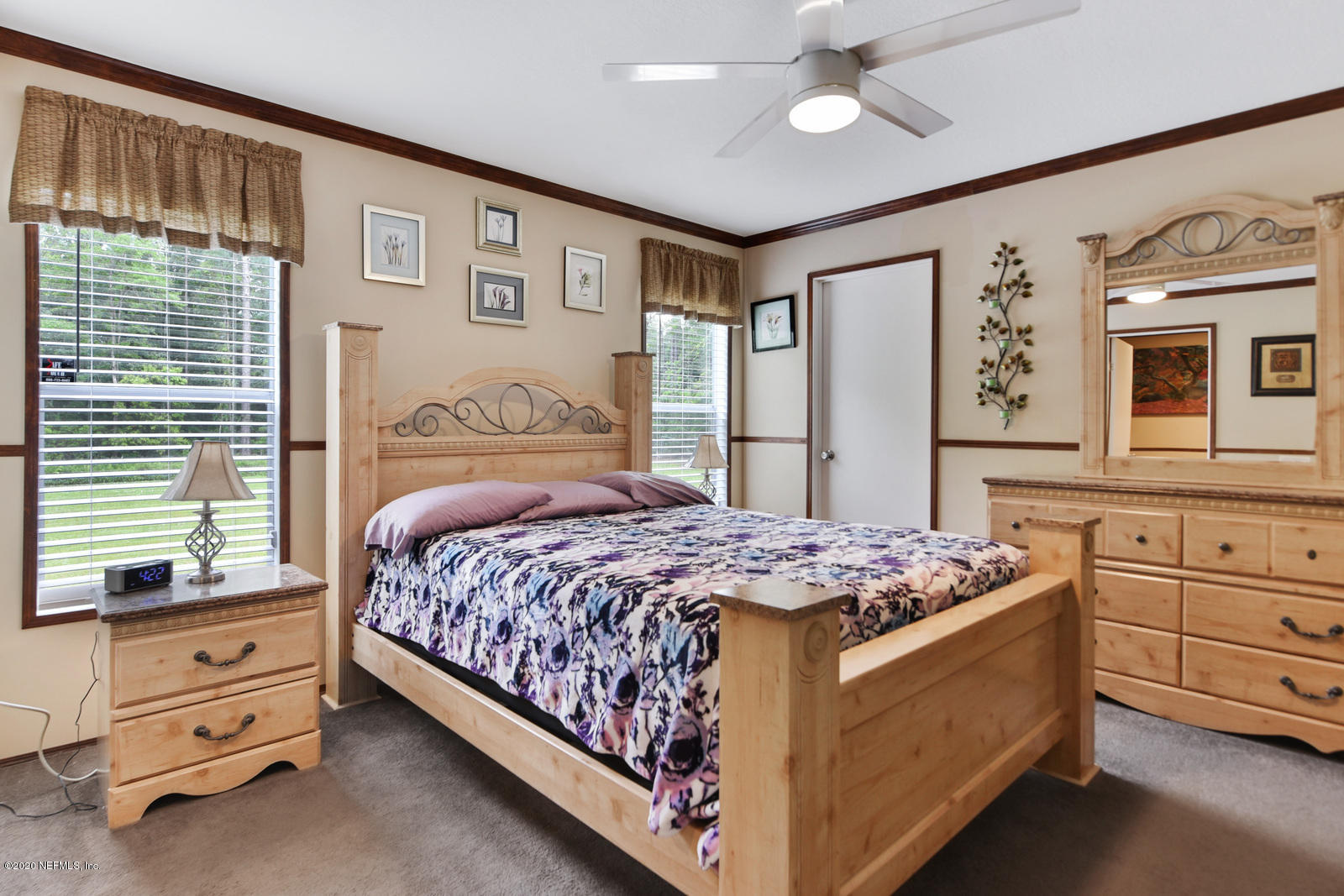54464 Sherwood Road Callahan, FL 32011 - Photo 14 of 25 a bedroom with a bed and a dresser