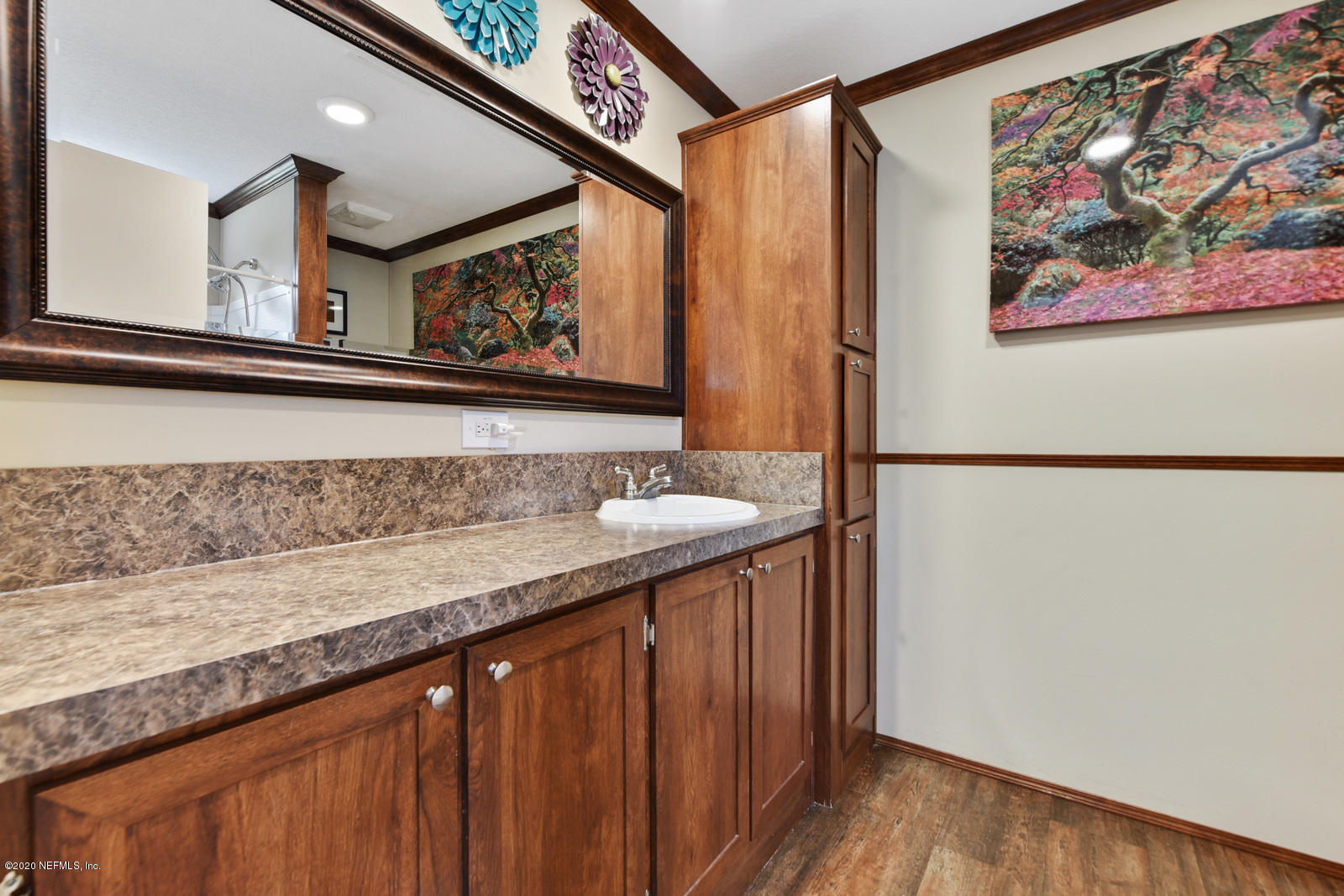 54464 Sherwood Road Callahan, FL 32011 - Photo 15 of 25 a view of a hallway with wooden floor and staircase