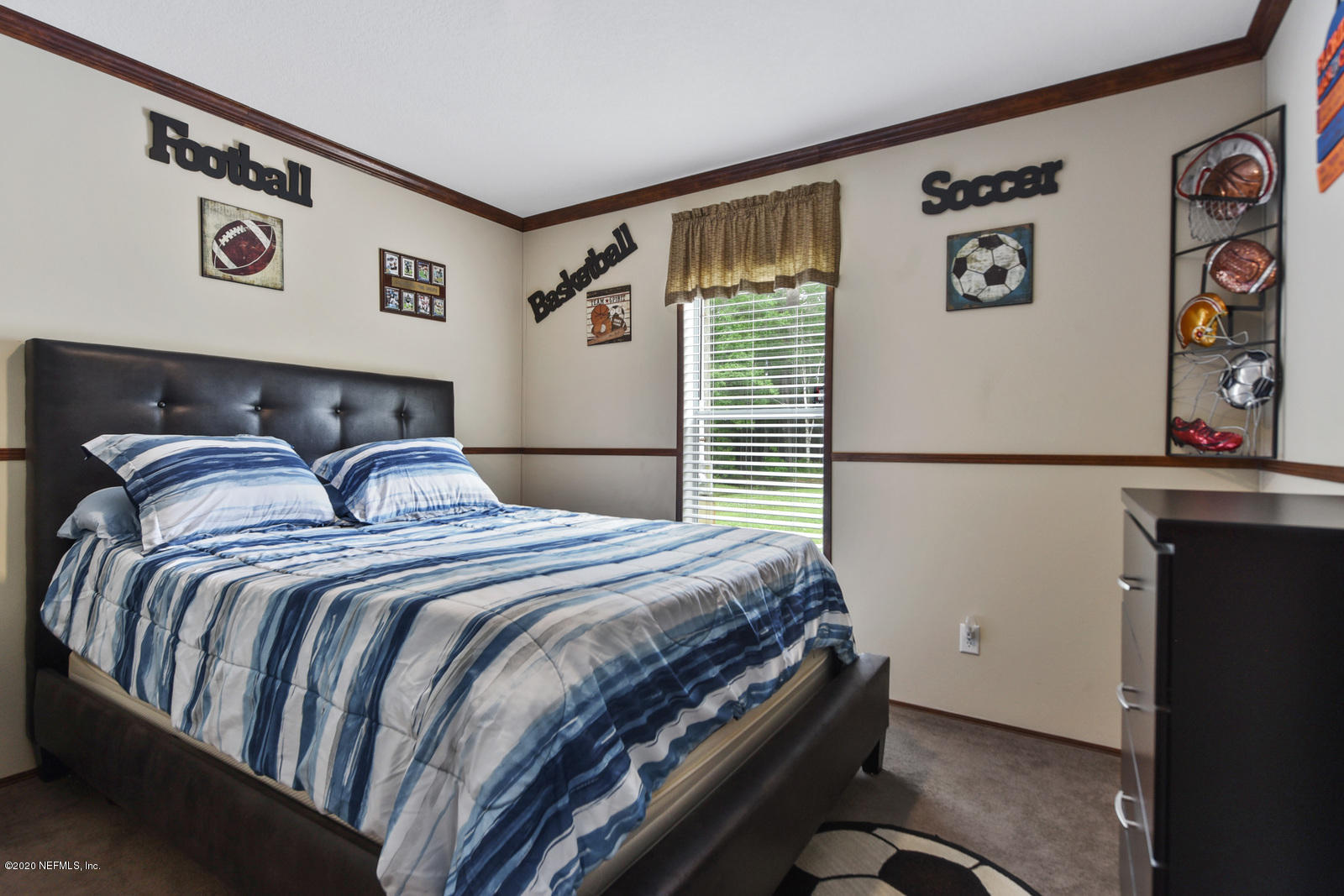 54464 Sherwood Road Callahan, FL 32011 - Photo 18 of 25 a bedroom with a bed and cabinets