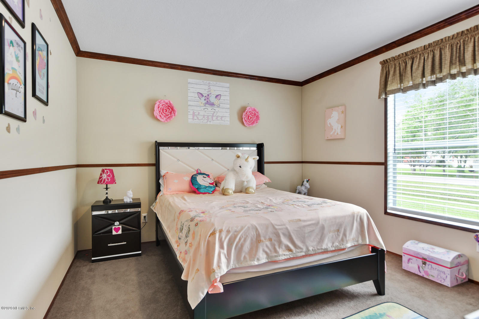 54464 Sherwood Road Callahan, FL 32011 - Photo 19 of 25 a bedroom with a bed a dresser and a window