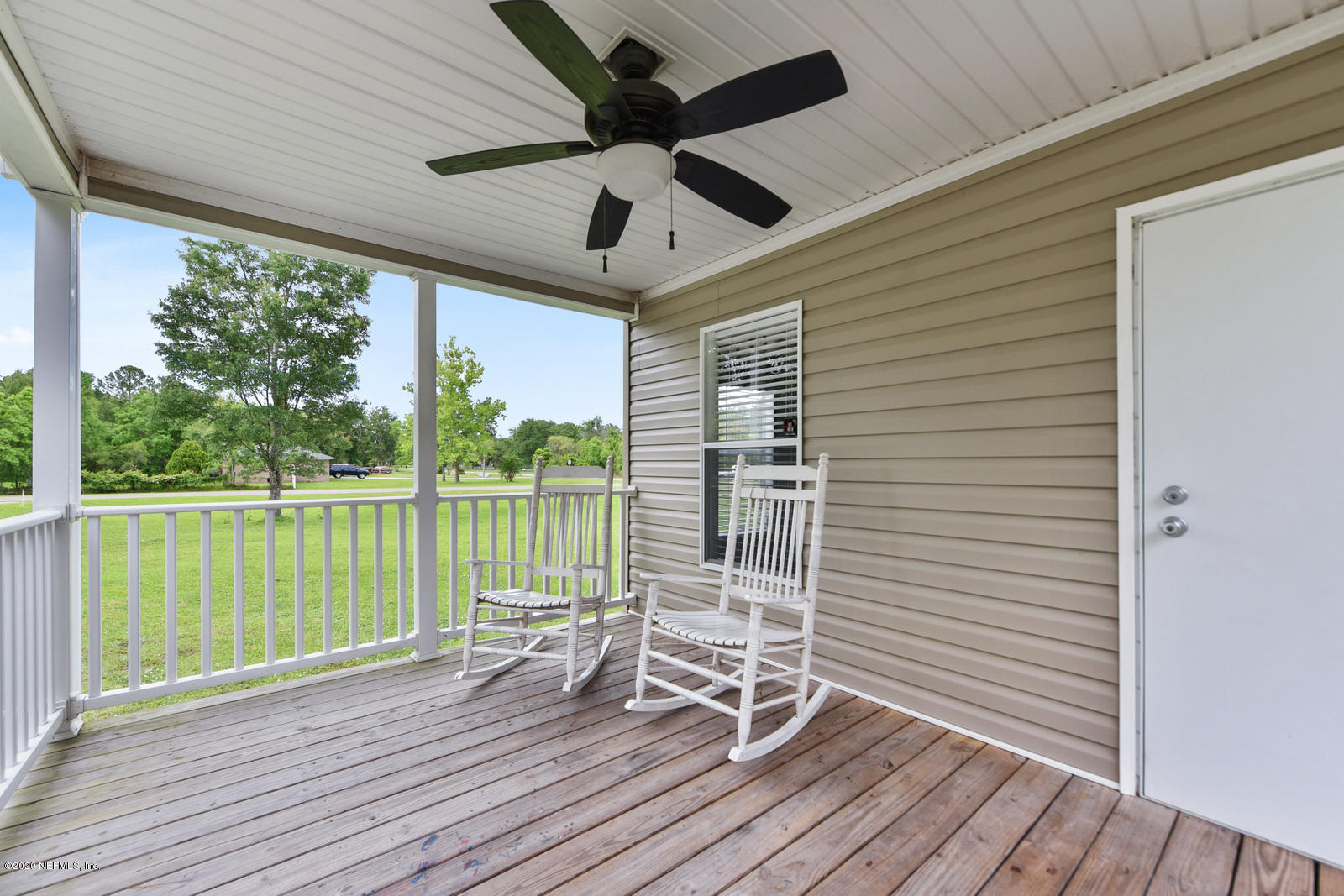 54464 Sherwood Road Callahan, FL 32011 - Photo 22 of 25 a view of a balcony with wooden floor
